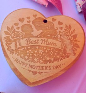 Mother’s Day engraved floral design on timber boar