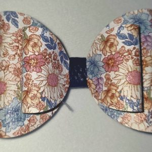 Extra‑large blue and floral layered bow with textured finish